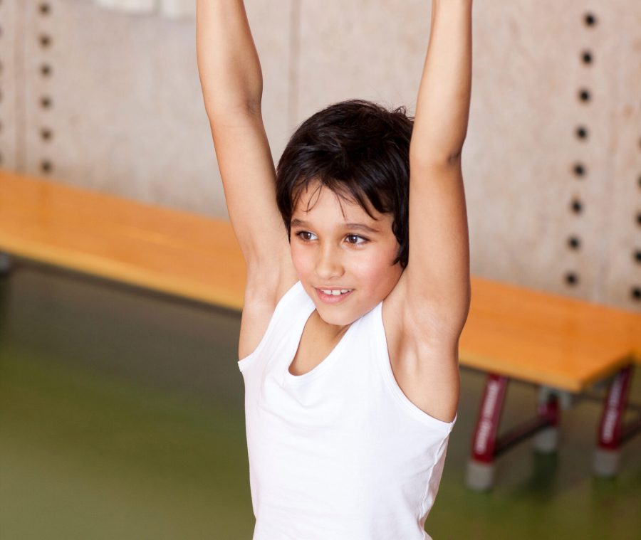young-schoolboy-hanging-on-gymnastic-pole-in-gym-2026-03-26-08-35-41-utc
